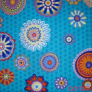 Tecido Loneta com o Padrão Mandalas em Fundo Azul Turquesa - Outlet